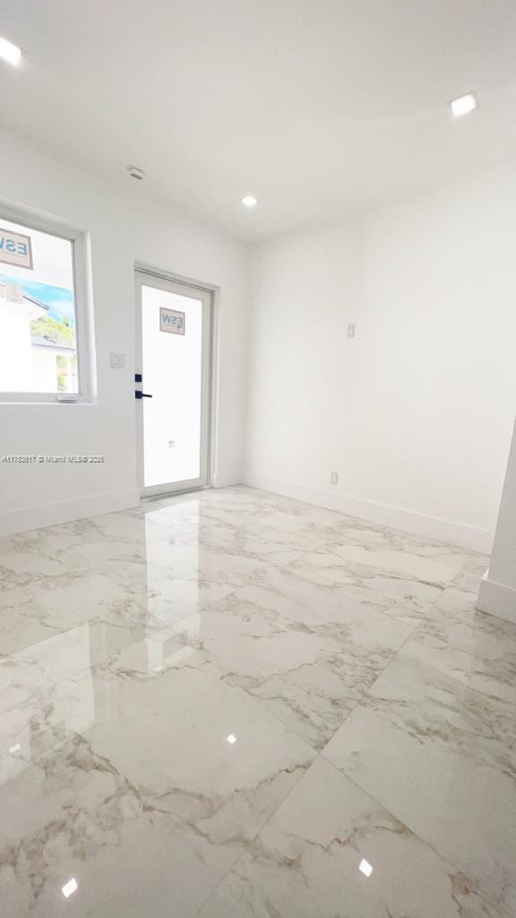 1013 NW 1st Ave, Hallandale Beach, FL 33009 - empty room with baseboards, marble finish floor, and recessed lighting