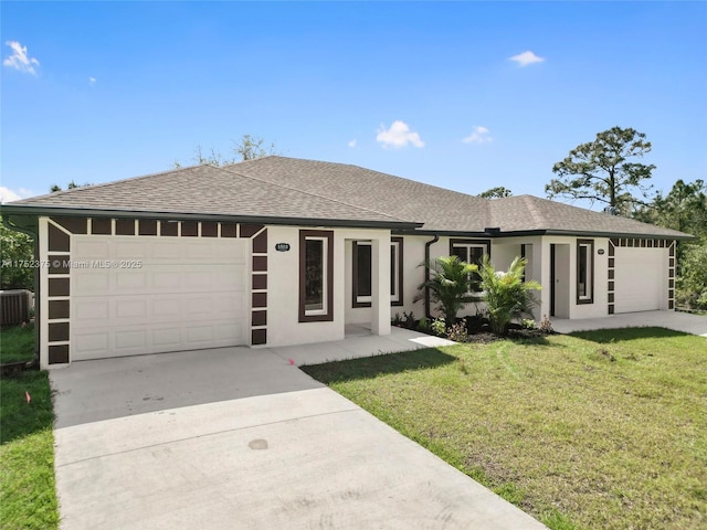 ranch-style home featuring a front yard, driveway, an attached garage, and stucco siding