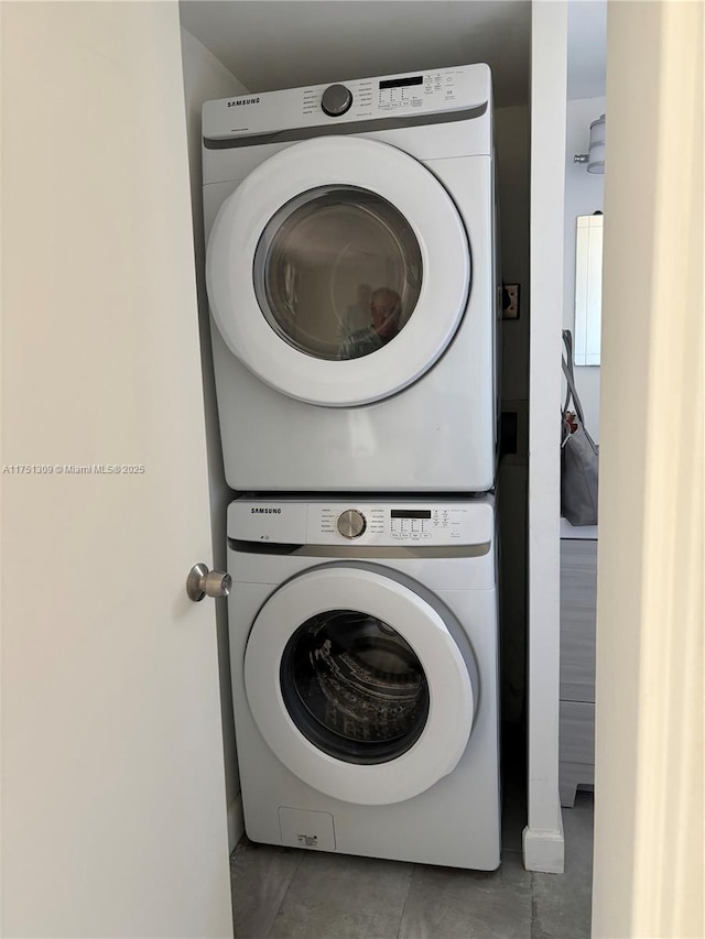 laundry room featuring laundry area and stacked washing maching and dryer