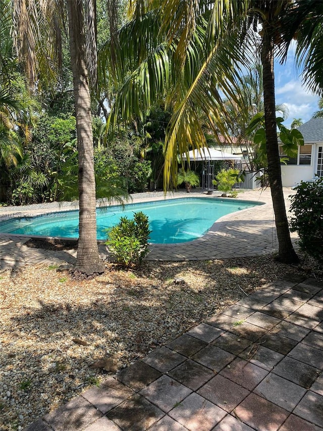 outdoor pool with a patio