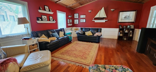 living room featuring a wainscoted wall, wood finished floors, wood ceiling, and lofted ceiling