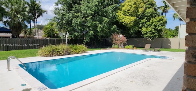 view of swimming pool featuring a fenced backyard, a fenced in pool, and a patio