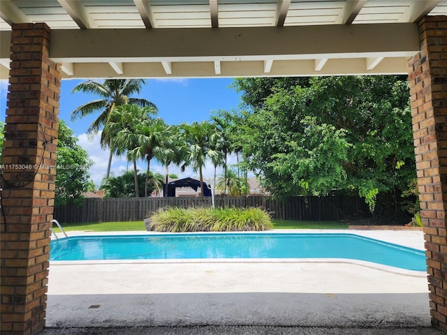 view of pool featuring a patio area, a fenced backyard, and a fenced in pool