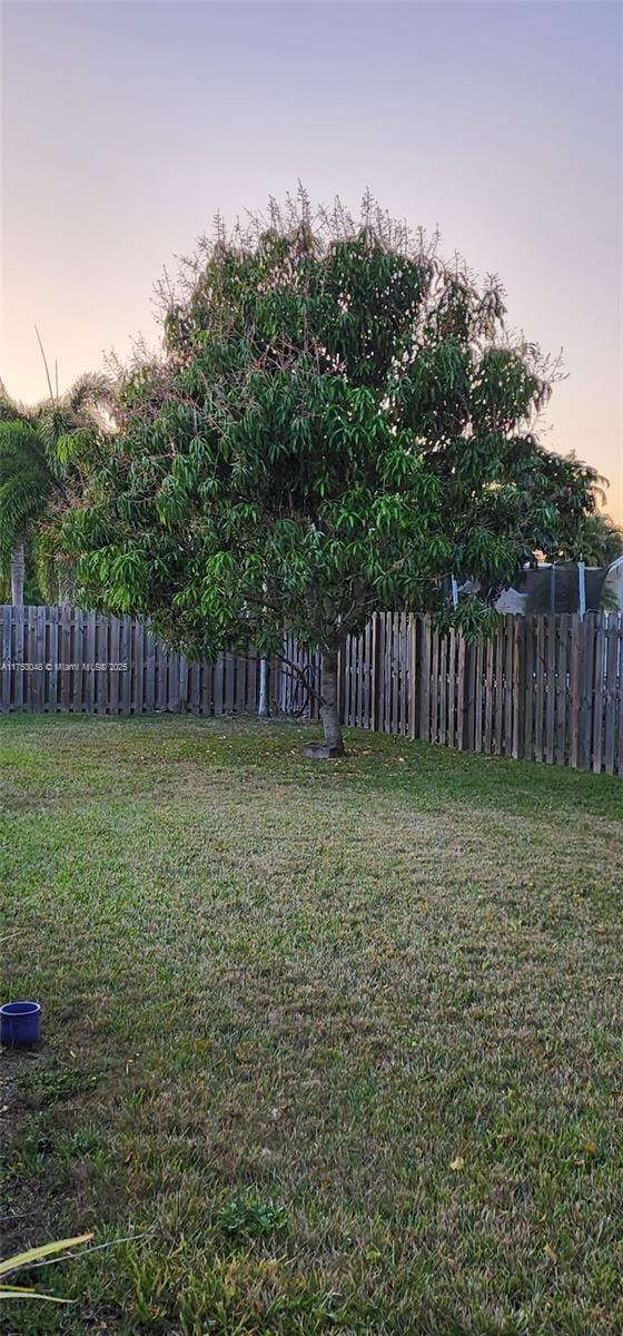 yard at dusk with fence