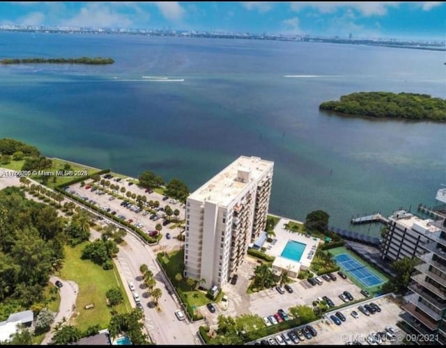 birds eye view of property with a water view