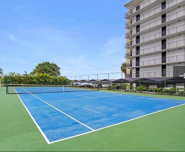 view of tennis court with fence