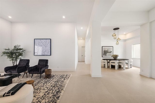 sitting room with recessed lighting and baseboards