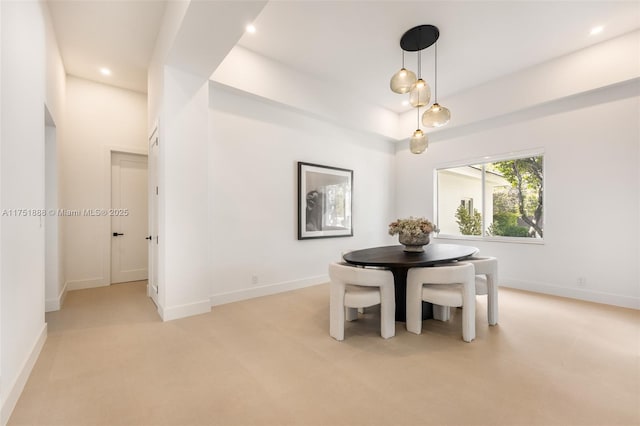 unfurnished dining area featuring baseboards and recessed lighting