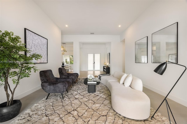 living room featuring recessed lighting, visible vents, baseboards, and french doors