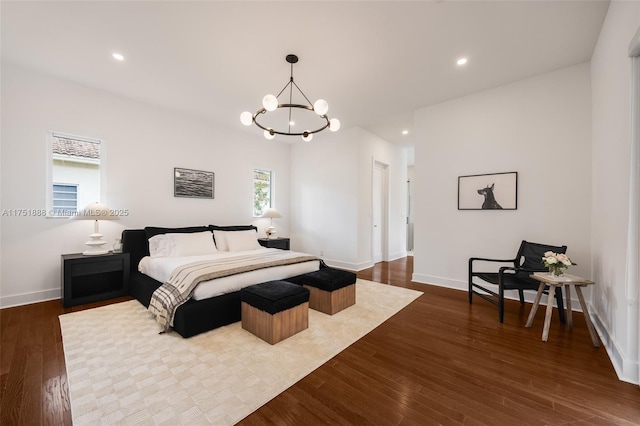 bedroom featuring baseboards, a chandelier, dark wood-type flooring, and recessed lighting