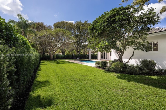 view of yard featuring a fenced backyard and a fenced in pool