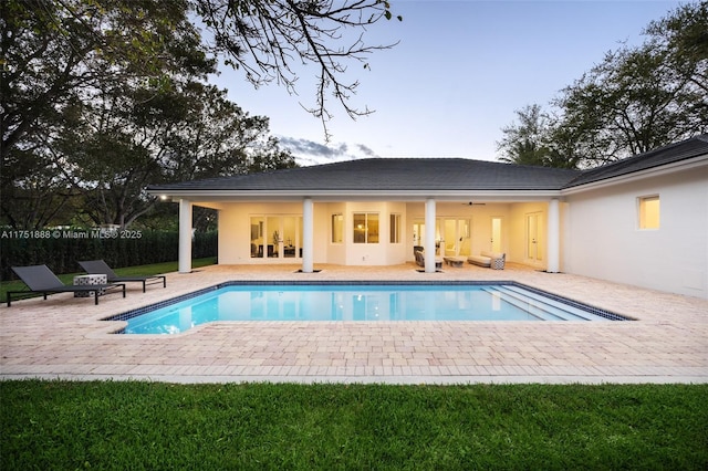 view of pool with a fenced in pool, a patio area, and fence