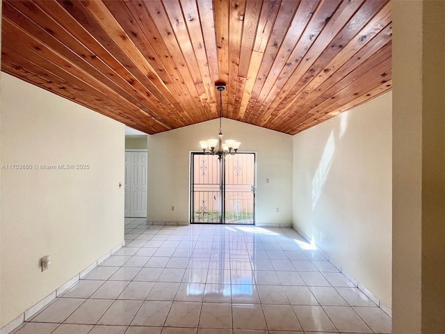 spare room featuring light tile patterned floors, baseboards, lofted ceiling, wood ceiling, and a chandelier