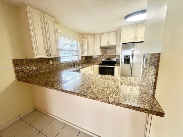 kitchen with a sink, electric stove, stainless steel refrigerator with ice dispenser, open shelves, and tasteful backsplash