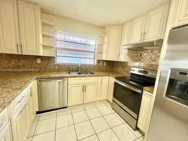 kitchen with appliances with stainless steel finishes, a sink, under cabinet range hood, and open shelves