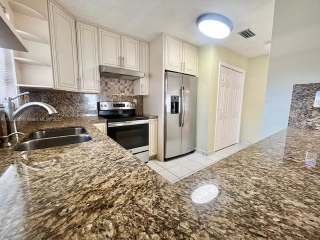 kitchen with open shelves, visible vents, appliances with stainless steel finishes, a sink, and under cabinet range hood