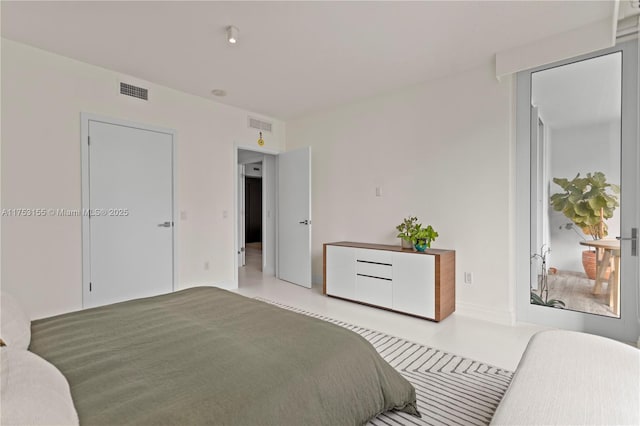 bedroom featuring visible vents