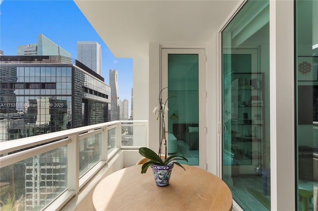 balcony featuring a view of city and wine cooler