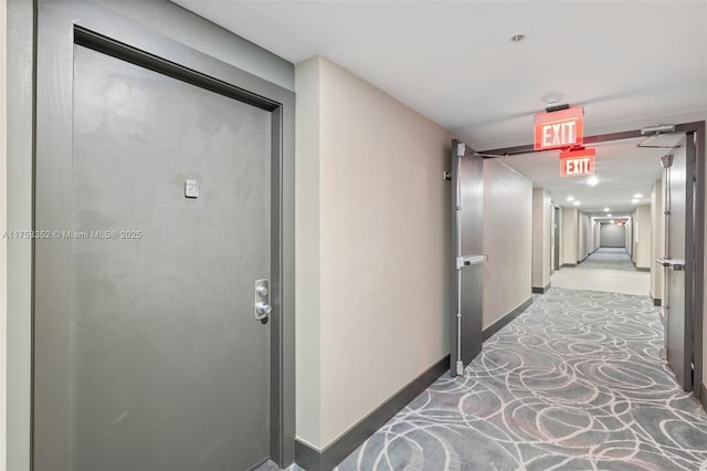 hallway featuring baseboards