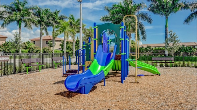 communal playground featuring fence