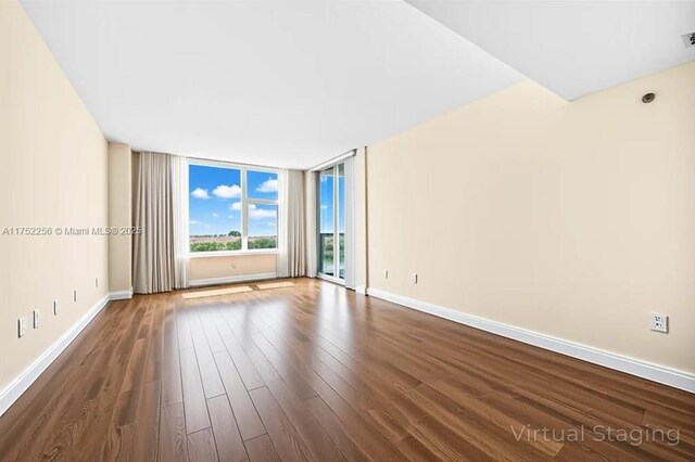 2681 N Flamingo Rd Unit 1103S, Sunrise, FL 33323 - empty room featuring dark wood-style floors and baseboards