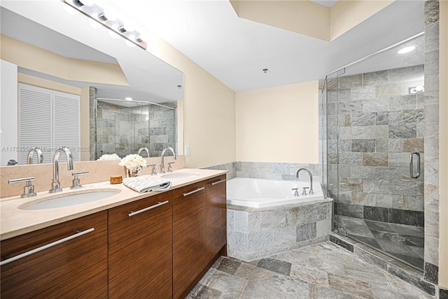 2681 N Flamingo Rd Unit 1103S, Sunrise, FL 33323 - bathroom featuring a garden tub, double vanity, a stall shower, stone finish floors, and recessed lighting