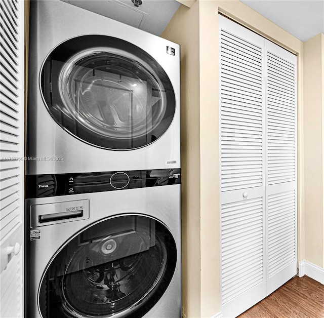 2681 N Flamingo Rd Unit 1103S, Sunrise, FL 33323 - washroom featuring stacked washer / dryer and wood finished floors