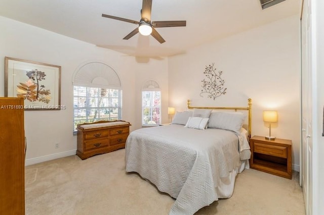 bedroom featuring ceiling fan, visible vents, baseboards, and carpet flooring