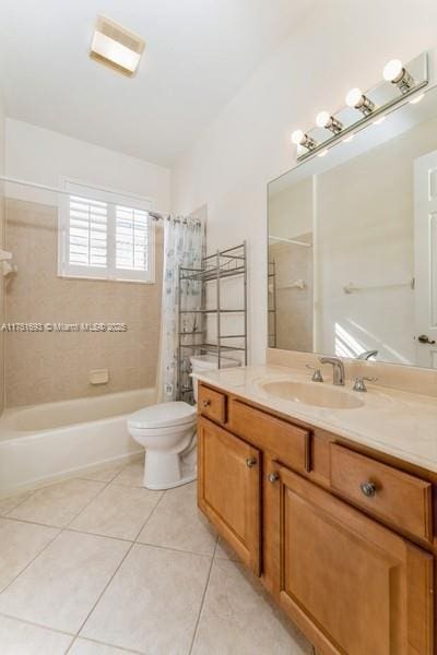 bathroom with shower / bathtub combination with curtain, vanity, toilet, and tile patterned floors