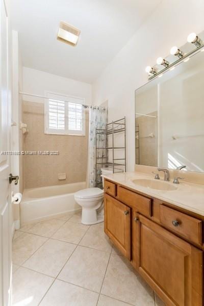 full bath with shower / tub combo, vanity, toilet, and tile patterned floors