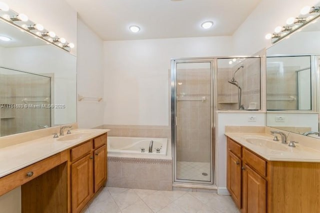 full bath featuring two vanities, a sink, a bath, and a shower stall