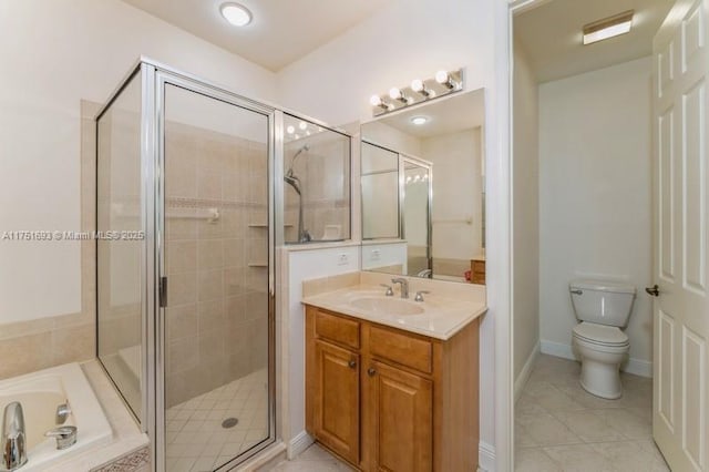 full bathroom featuring tile patterned flooring, toilet, vanity, a bath, and a stall shower