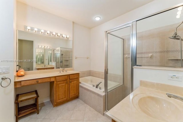 full bath with a stall shower, tile patterned floors, a sink, and a bath