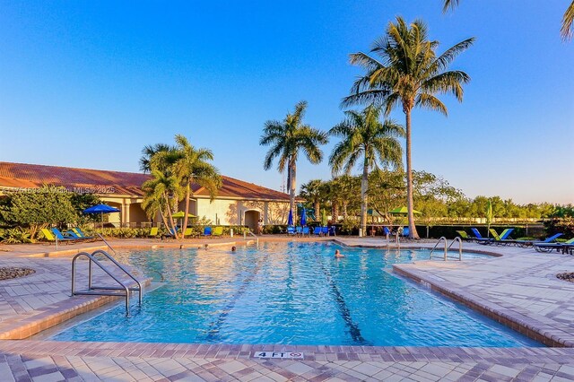 community pool with a patio