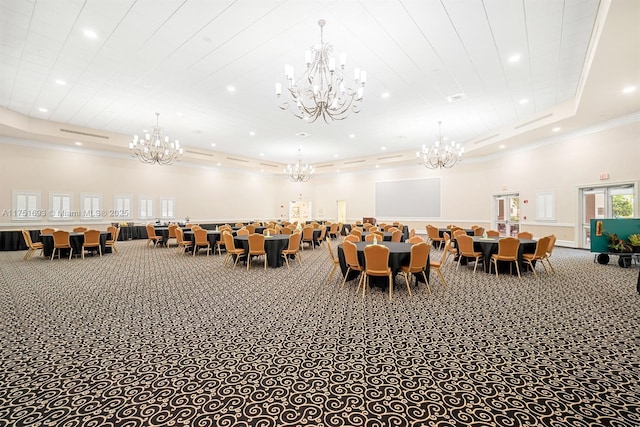 dining space with a notable chandelier, a tray ceiling, carpet flooring, and recessed lighting