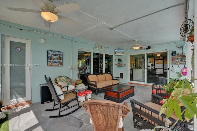 view of patio with ceiling fan and outdoor lounge area