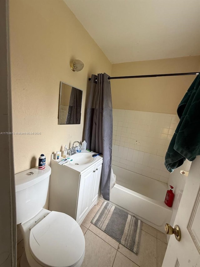 full bath featuring shower / tub combo with curtain, vanity, toilet, and tile patterned floors