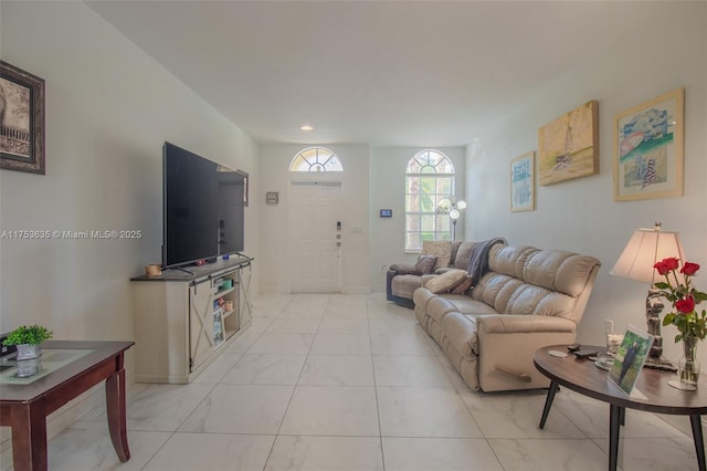 living room featuring baseboards