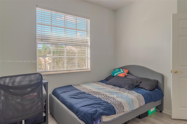 bedroom featuring wood finished floors