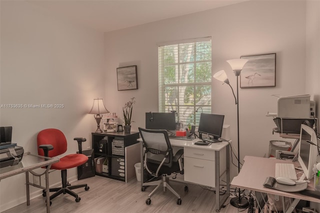 home office featuring light wood-style floors