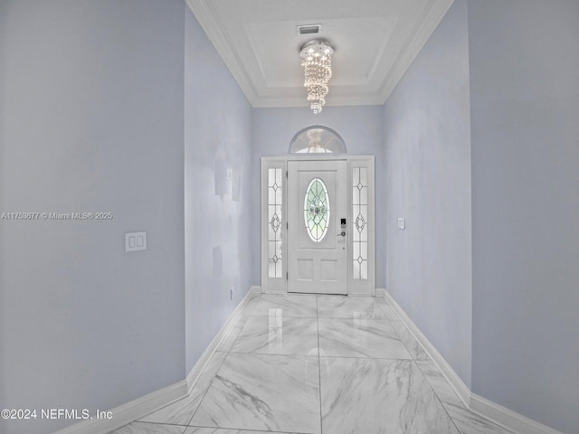 foyer featuring visible vents, baseboards, marble finish floor, ornamental molding, and an inviting chandelier