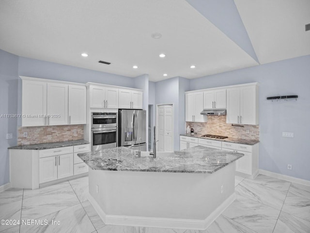 kitchen featuring under cabinet range hood, a large island, white cabinetry, and stainless steel appliances