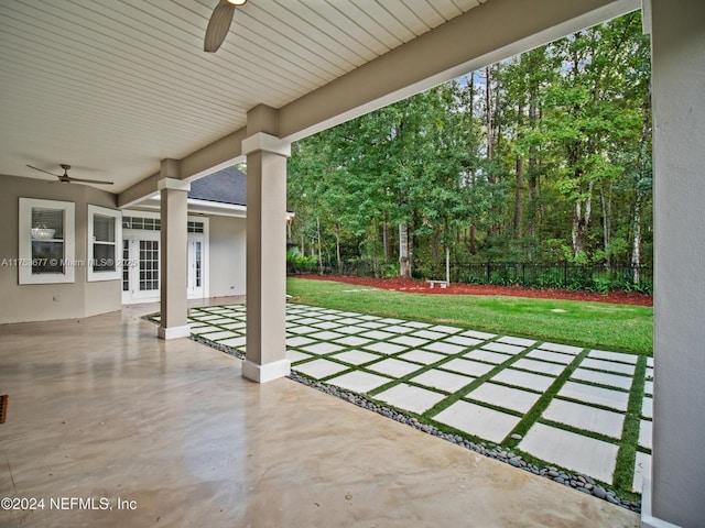 view of patio with fence, a ceiling fan, and french doors