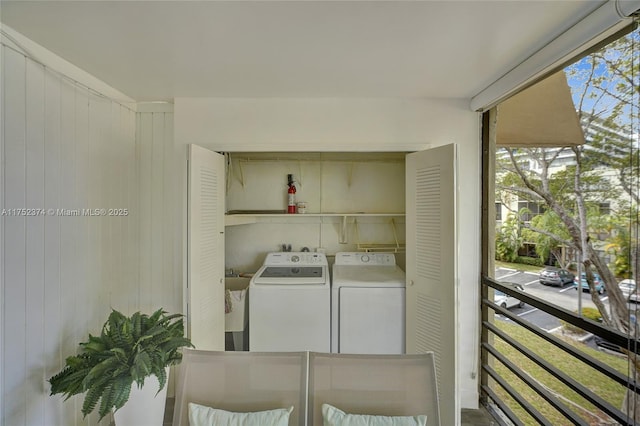 clothes washing area with laundry area and independent washer and dryer