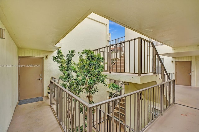 balcony featuring stairway