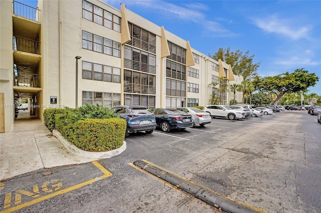 view of property featuring uncovered parking