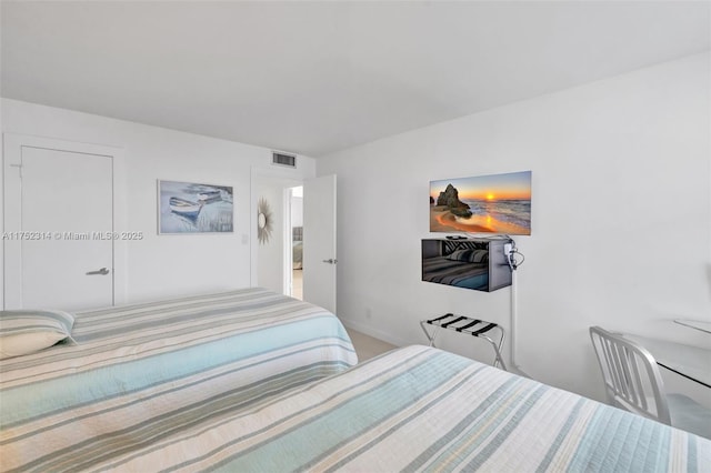 bedroom featuring visible vents