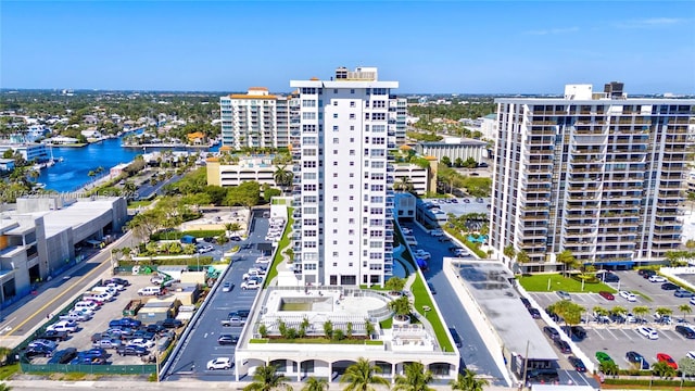 birds eye view of property featuring a view of city and a water view