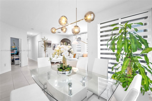 dining area with light tile patterned floors and baseboards