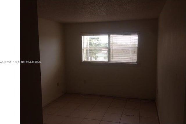 empty room with a textured ceiling